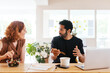© BONNINSTUDIO/Stocksy - Multiracial coworkers talking during lunch in workplace