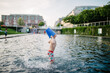 © Cameron Whitman/Stocksy - Boy cools himself off with water