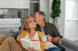 © Valentina Barreto/Stocksy - Lovely senior couple relaxing at home