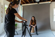 © Jayme Burrows/Stocksy - Woman Sets Up Photo Shoot on Tripod