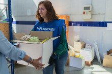 Volunteer Woman Deliver A Food Packages
