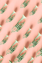 Green Trumpets On Pink Background