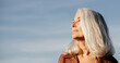 © Alba Vitta/Stocksy - Active mature woman enjoying the beach in the morning
