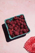 Box Of Raspberries In The Sun