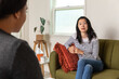 © Jayme Burrows/Stocksy - Woman Talking to Psychotherapist