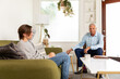 © Jayme Burrows/Stocksy - Therapist and Client Sit in a Session