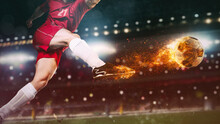 Close Up Of A Soccer Scene At Night Match With Player In A Red Uniform Kicking A Fiery Ball With Power