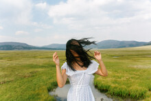 Girl With Hair In Face In Caldera Mountain Prairie 