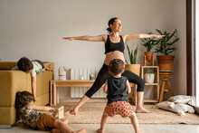 Pregnant Woman Doing Yoga At Home