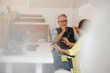 © KOTO - Man and woman sitting in office and talking