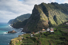 A View Of Mountains Meeting The Ocean On The Coast Of Madeira Island
