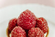 © Vera Lair/Stocksy - raspberries tartlet