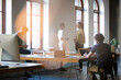 © KOTO - Casual business people working in open office