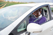 © JackF - Portrait of frightened african american driver behind wheel of car with scared passengers. Road accident hazard concept