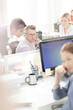 © KOTO - Business people working at computer in office