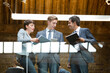 © KOTO - Business people talking in modern building