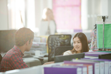 Poster - Fashion designers talking at desk in office