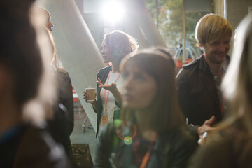 Conference audience watching speakers on stage