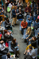 Conference audience watching speakers on stage