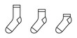 Socks icon. Set of black linear socks. Vector illustration.