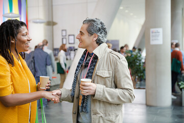 Canvas Print - People talking during conference break