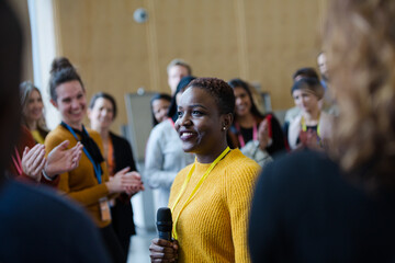 Wall Mural - Female speaker talking to audience