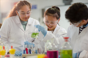 Wall Mural - students watching chemical reaction, conducting scientific experiment in laboratory classroom