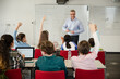© KOTO - Male teacher leading lesson at whiteboard in classroom
