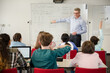 © KOTO - Male teacher leading lesson at whiteboard in classroom