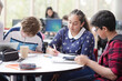 © KOTO - Students using laptop at table
