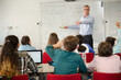 © KOTO - Male teacher leading lesson at whiteboard in classroom