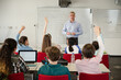 © KOTO - Male teacher leading lesson at whiteboard in classroom