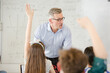 © KOTO - Male teacher leading lesson at whiteboard in classroom