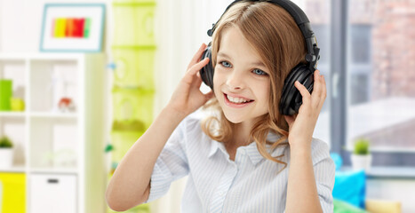 Sticker - technology and music concept - happy smiling girl with headphones over home room background