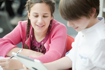 Wall Mural - students using digital tablet in library
