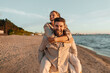 © Syda Productions - leisure and people concept - happy couple having fun on summer beach