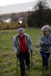 © KOTO - Smiling, affectionate senior couple wih walking sticks