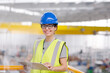Portrait confident female supervisor with clipboard in steel factory