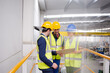© KOTO - Supervisors and worker with clipboard talking in factory