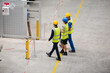 © KOTO - Supervisor and workers walking in factory