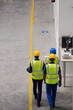 © KOTO - Supervisor and workers walking in factory