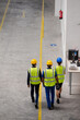 © KOTO - Supervisor and workers walking in factory