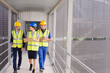 © KOTO - Supervisors and worker walking in factory
