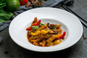 Poster - Spicy fragrant eggplant Chinese cuisine on white plate on black stone table