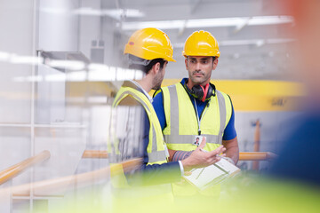 Wall Mural - Supervisor and worker talking in steel factory