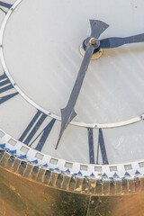 Wall Mural - Metal dial and chairs of a street clock in the park