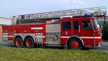 Fire Truck With Retractable Ladder For Extinguishing Fires At Height.  A Fire Truck For Delivering Firefighters To The Fire Site And Supplying Fire Extinguishing Agents To The Combustion Center.