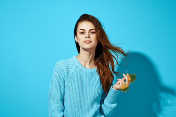 Poster - pretty woman in a blue sweater blue background Lifestyle