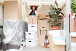 Girl standing on boxes in moving van