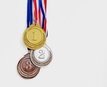 Gold, Silver And Bronze Medals Set On White Background. Sports Athletes Winners Prize